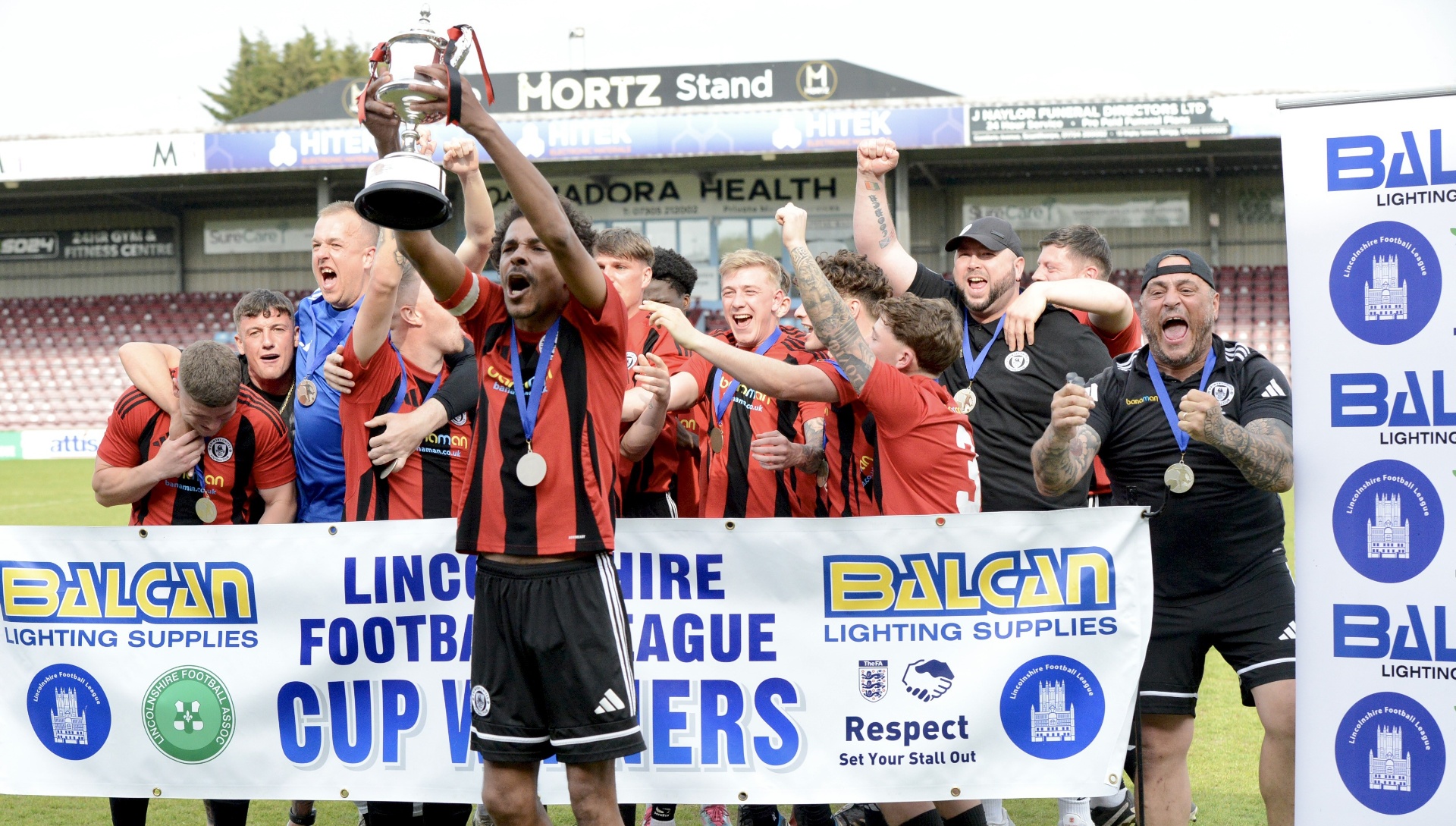 Grimsby United first team lifting the Lincolnshire Football League Supplementary Cup at Scunthorpe United